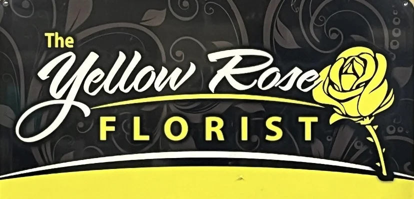 The Yellow Rose Florist sign with a yellow rose